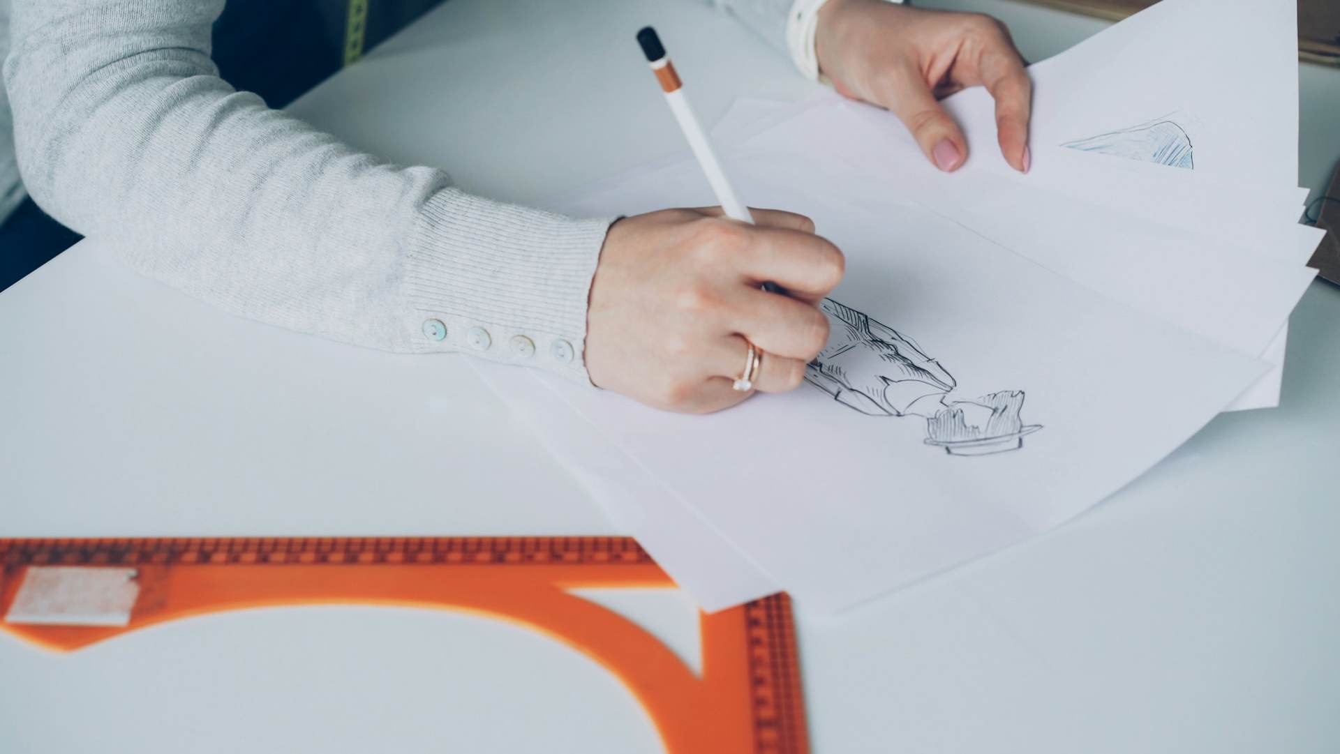 Hand sketching a garment design