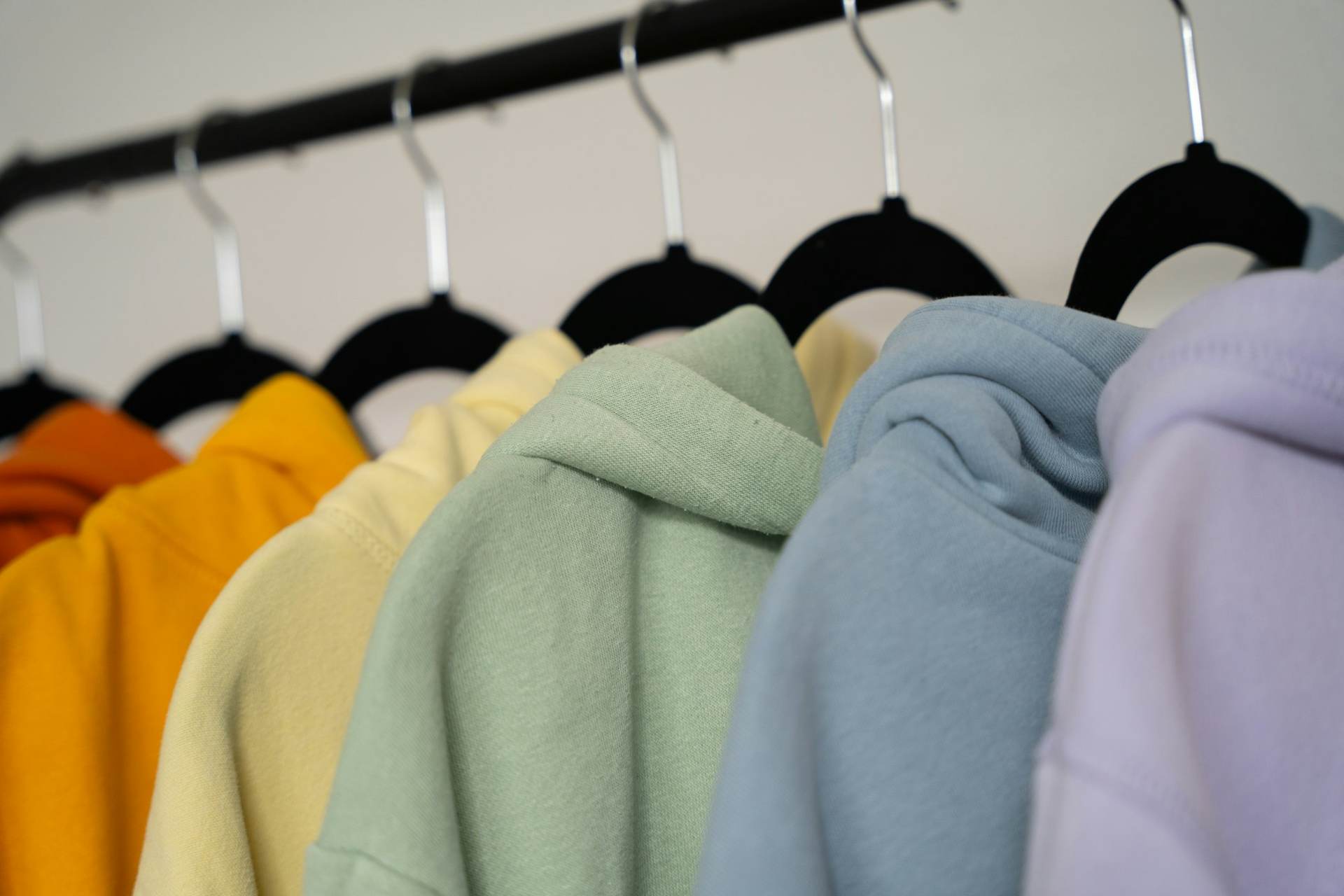 Rack of colourful hoodies