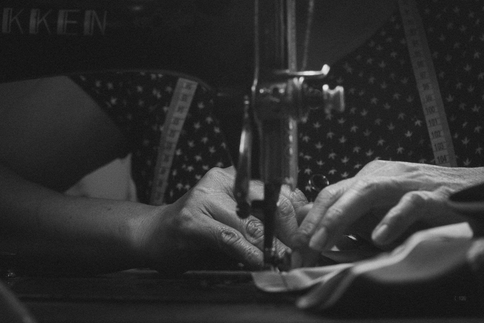 Hands working at a cutting table