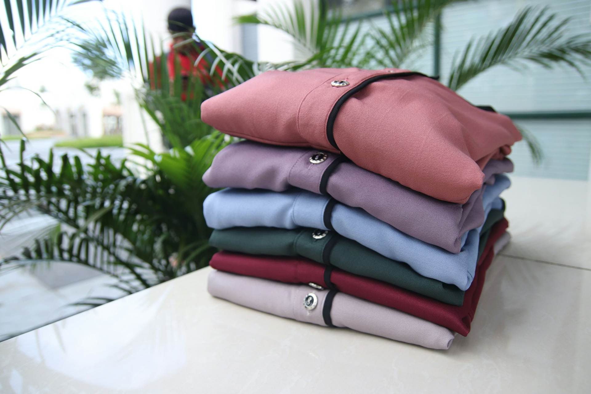 Stacks of folded clothes in different colours