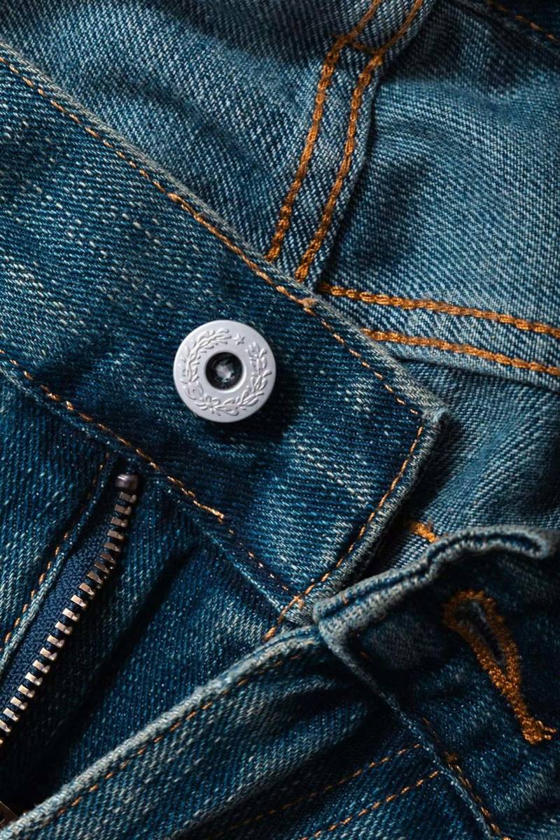 Custom rivets and buttons on denim