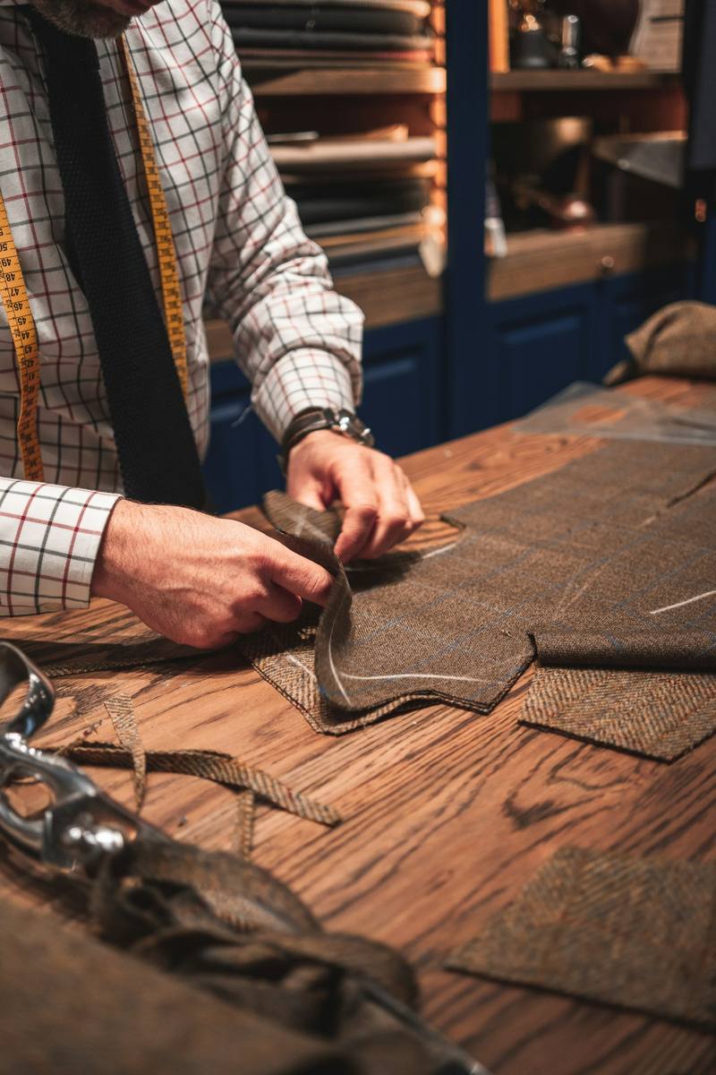 Hands checking the finish on a garment