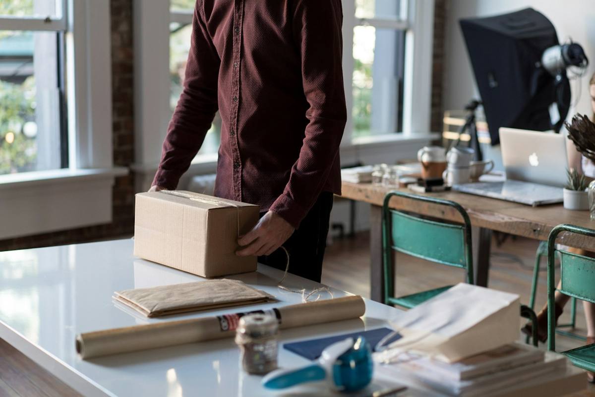 Packing an order into a cardboard box