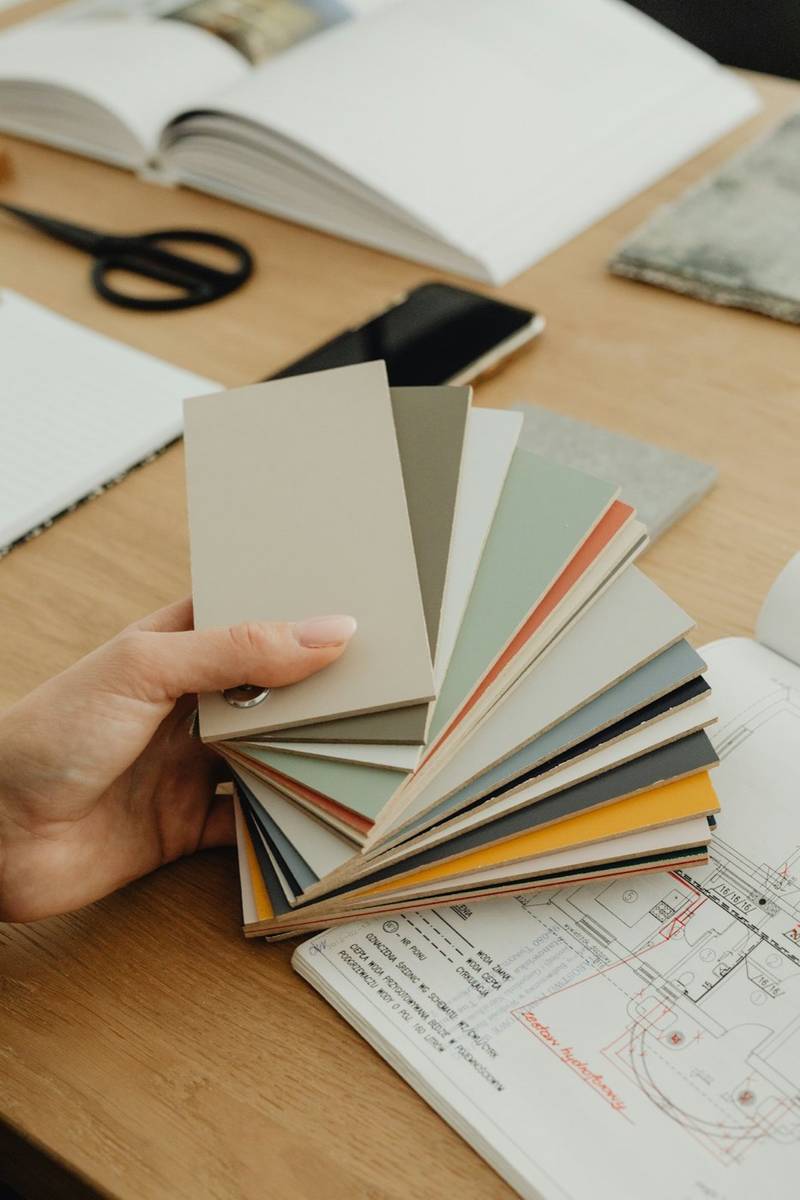 Hand holding fabric colour swatches