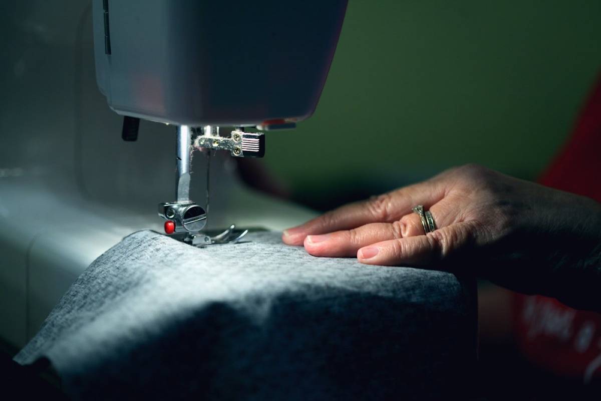 Sewing machine stitching dark fabric