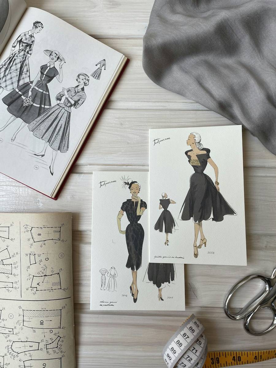 Fashion design sketches on a desk